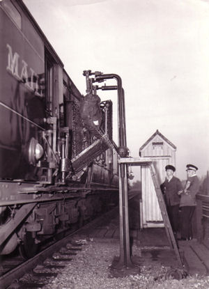 The Down Special TPO picking up the mails at speed at Harrow, north of London. Copyright GPO